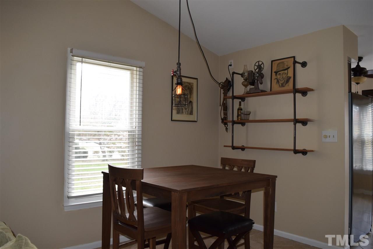 4404 Lake Ridge Drive Raleigh, NC 27604 - Photo 10 of 24 a view of a room that has a window and a table in it