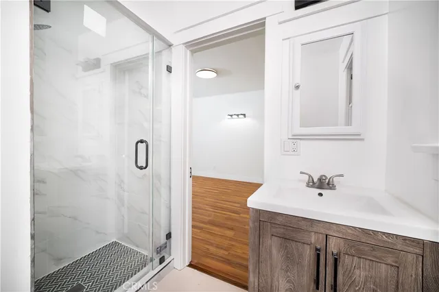 a bathroom with a shower and a sink