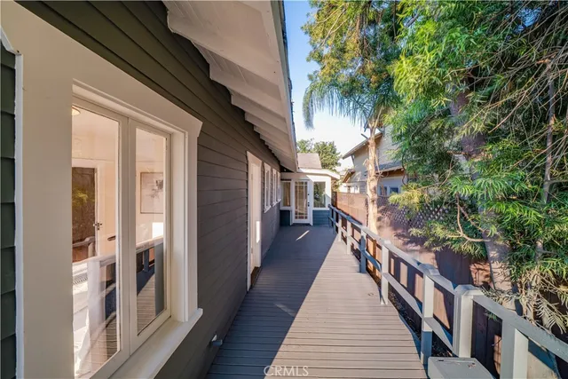 a view of a pathway of a house with a balcony