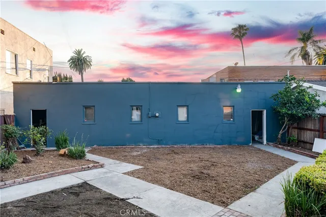 a house view with a backyard space