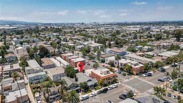 an aerial view of residential houses with city view