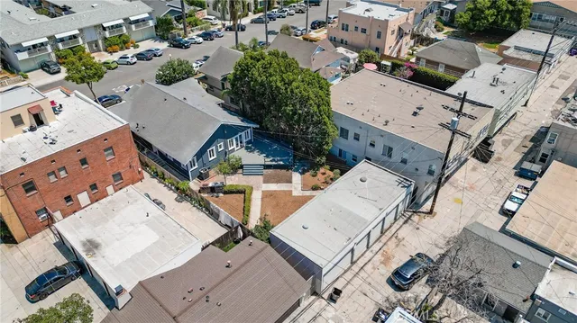 an aerial view of a residential houses with outdoor space