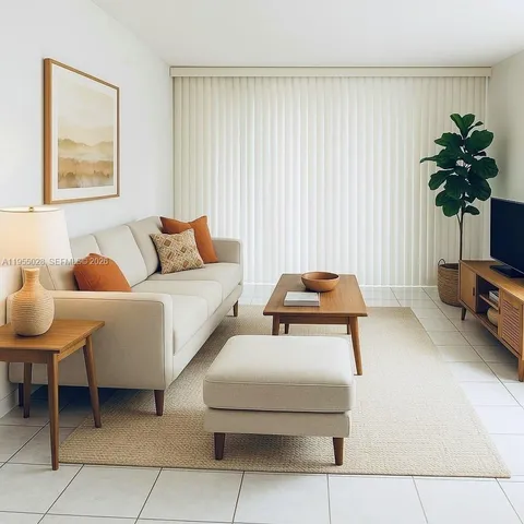 a living room with furniture flowerpot and a window