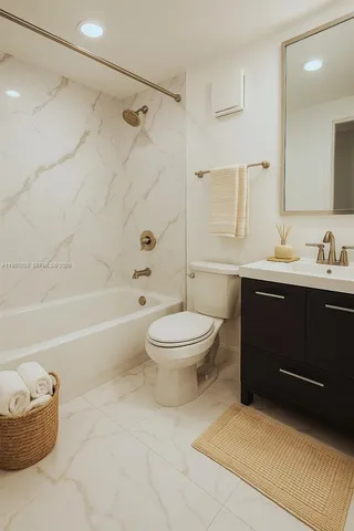 a bathroom with a toilet a sink and bathtub
