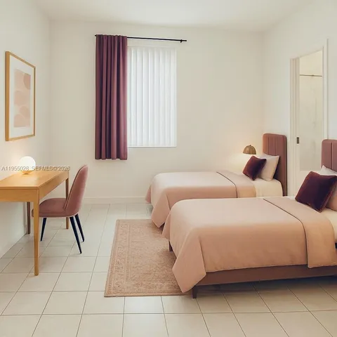 a bedroom with a bed and a chair