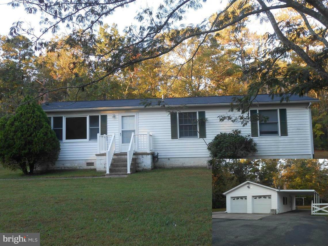 18111 Three Notch Road Lexington Park, MD 20653 - Photo 1 of 23 a front view of house with yard and green space