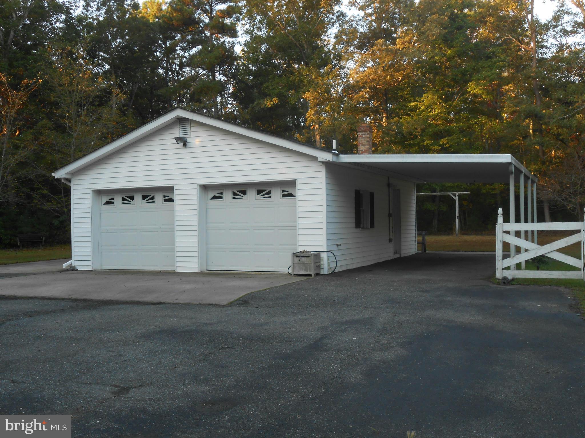 18111 Three Notch Road Lexington Park, MD 20653 - Photo 12 of 23 a view of a house with a yard and large tree