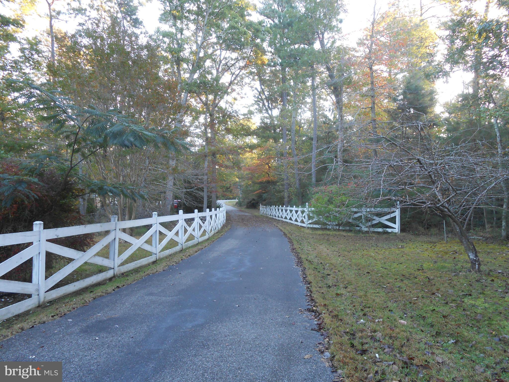 18111 Three Notch Road Lexington Park, MD 20653 - Photo 21 of 23 a view of a couches with wooden fence