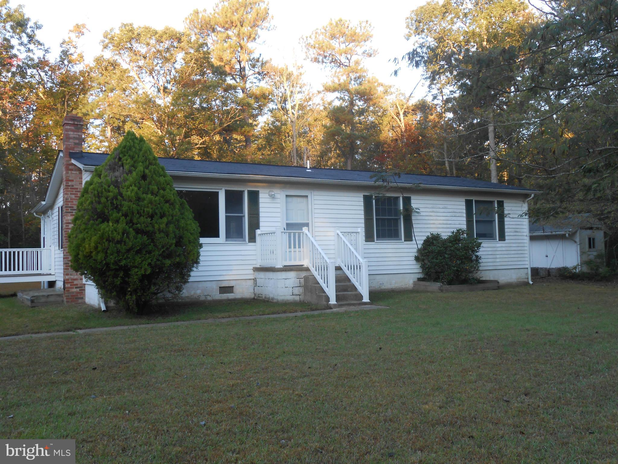 18111 Three Notch Road Lexington Park, MD 20653 - Photo 23 of 23 a front view of house with yard and green space