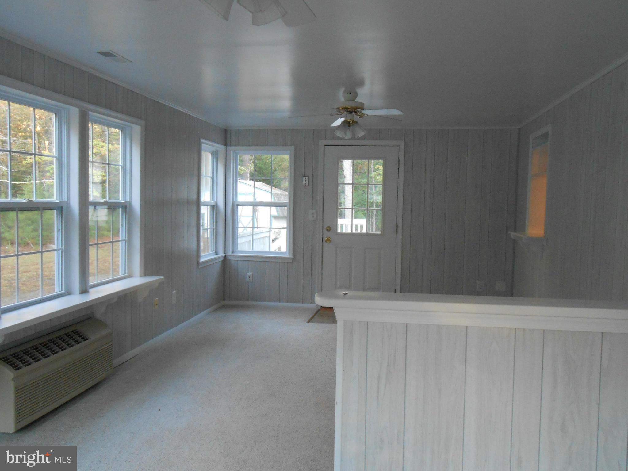 18111 Three Notch Road Lexington Park, MD 20653 - Photo 7 of 23 a view of an empty room with a window
