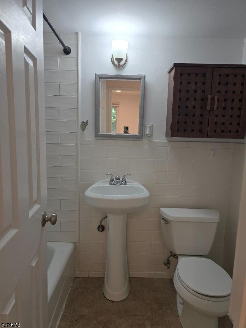 2350 Route 10 Morris Plains, Unit D14 Morris Plains, NJ 07950 - Photo 12 of 13 a bathroom with a toilet a sink and bathtub