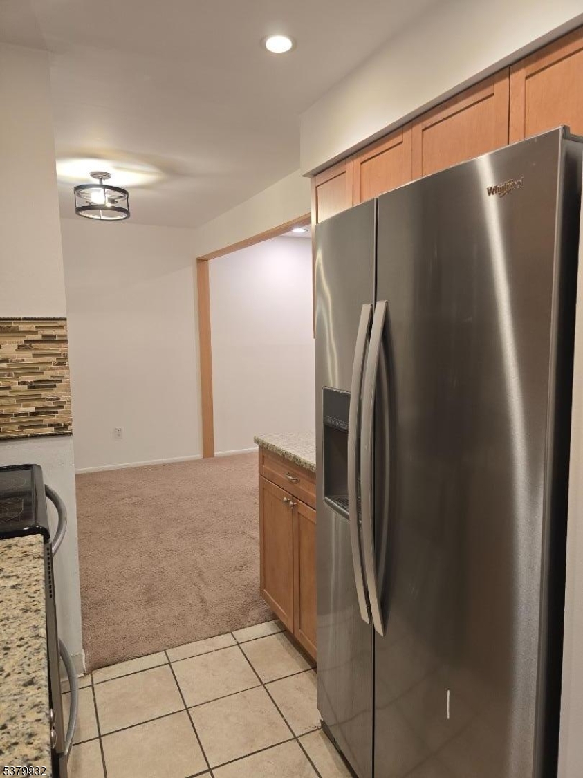2350 Route 10 Morris Plains, Unit D14 Morris Plains, NJ 07950 - Photo 7 of 13 a metallic refrigerator freezer sitting in a kitchen