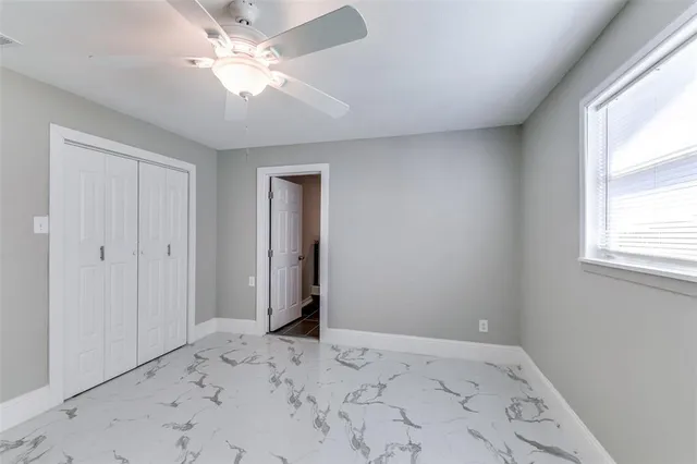 a bathroom with a bathtub shower sink vanity and toilet