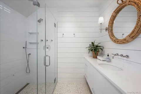 a bathroom with a sink and a mirror