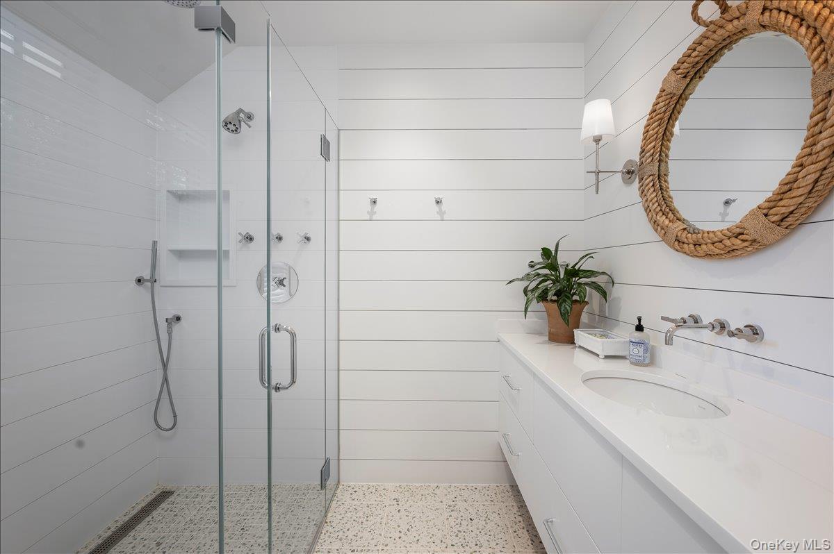 33 Pryer Lane Larchmont, NY 10538 - Photo 18 of 37 a bathroom with a sink and a mirror