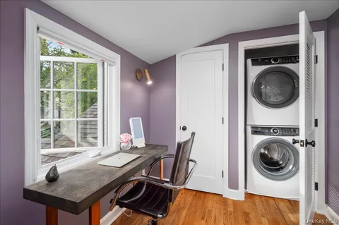 a view of a dining room with furniture window and wooden floor