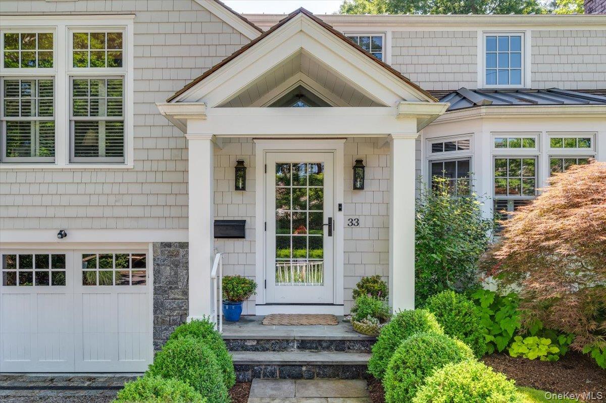 33 Pryer Lane Larchmont, NY 10538 - Photo 3 of 37 a view of a brick house with large windows and plants
