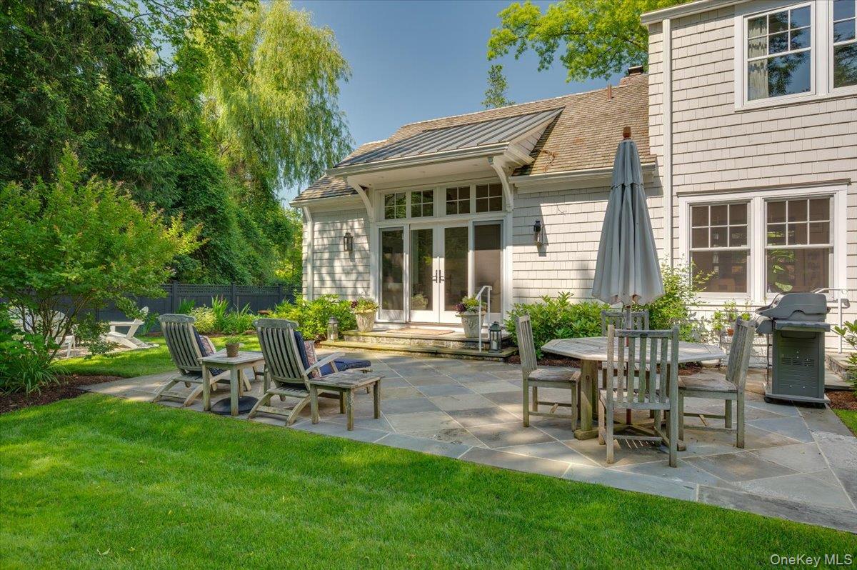 33 Pryer Lane Larchmont, NY 10538 - Photo 31 of 37 a view of a house with backyard sitting area and garden