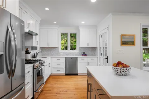 a kitchen with a sink stove and refrigerator