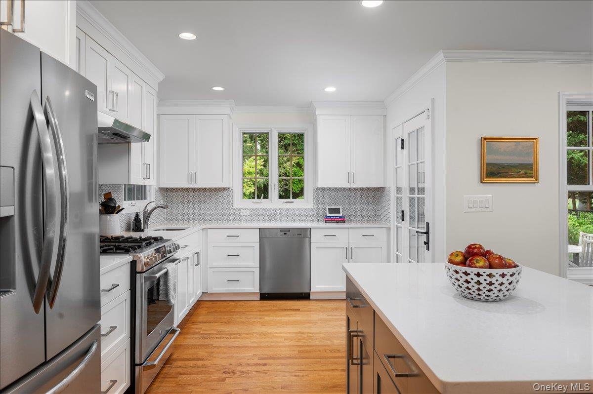 33 Pryer Lane Larchmont, NY 10538 - Photo 8 of 37 a kitchen with a sink stove and refrigerator