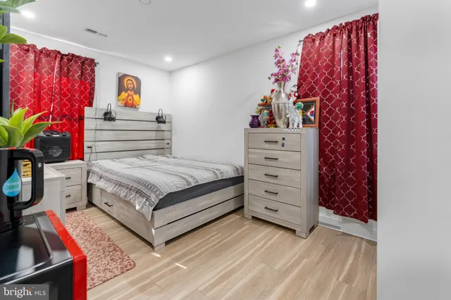 a bedroom with a bed and a bookshelf