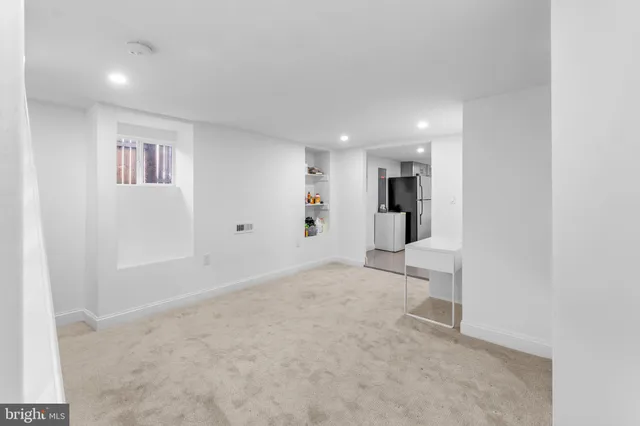 a view of an empty room with a cabinet