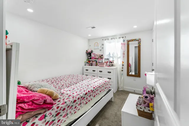 a bedroom with bed and a window