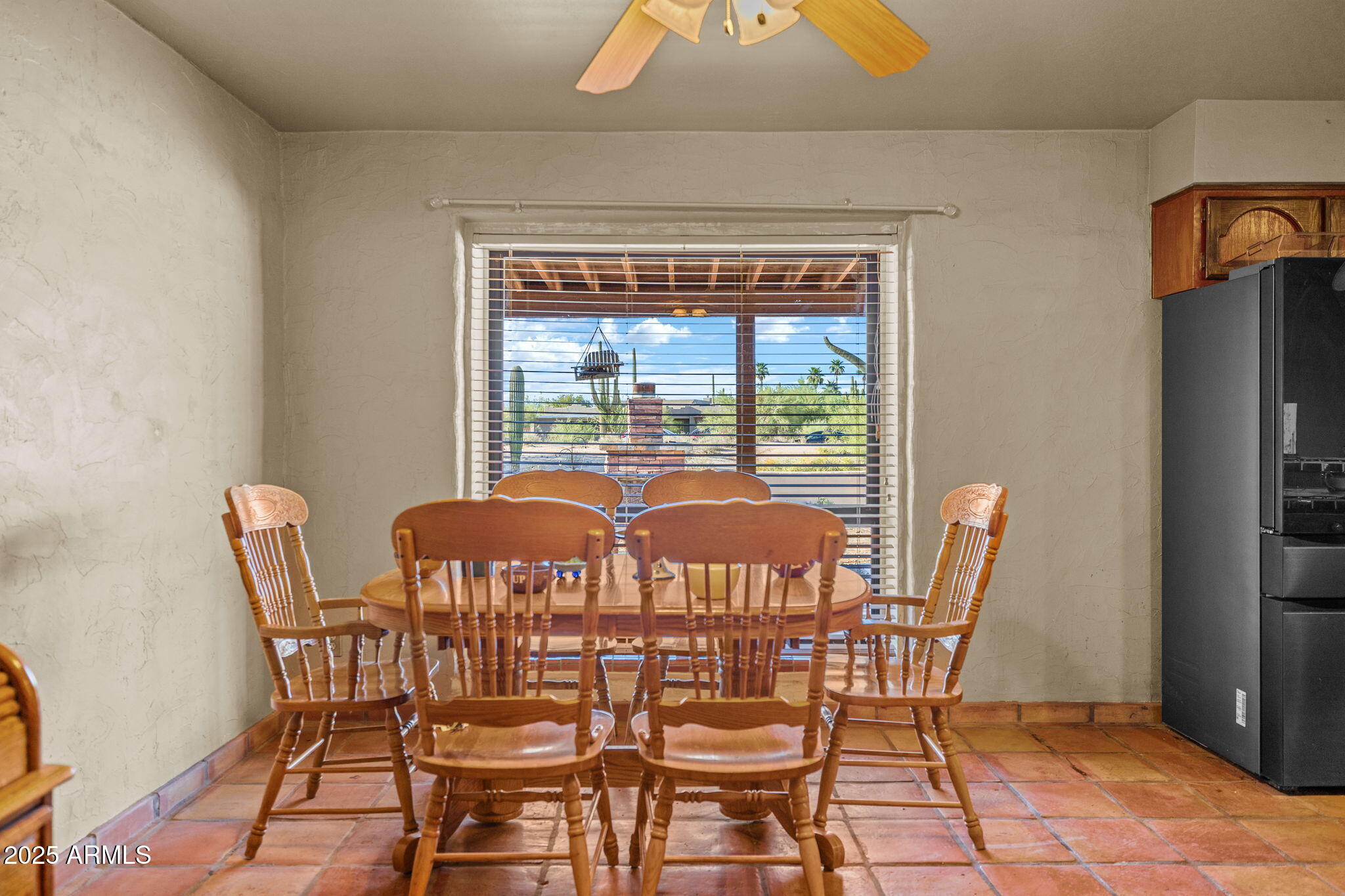 6319 East Lowden Road Cave Creek, AZ 85331 - Photo 21 of 52 a view of a dining room with furniture and window