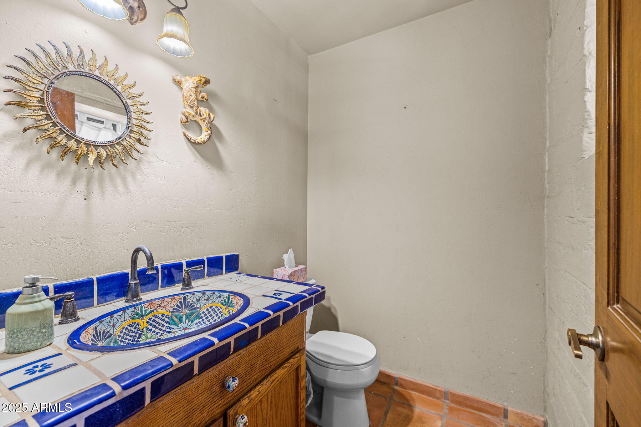 6319 East Lowden Road Cave Creek, AZ 85331 - Photo 29 of 52 a bathroom with a toilet and a sink