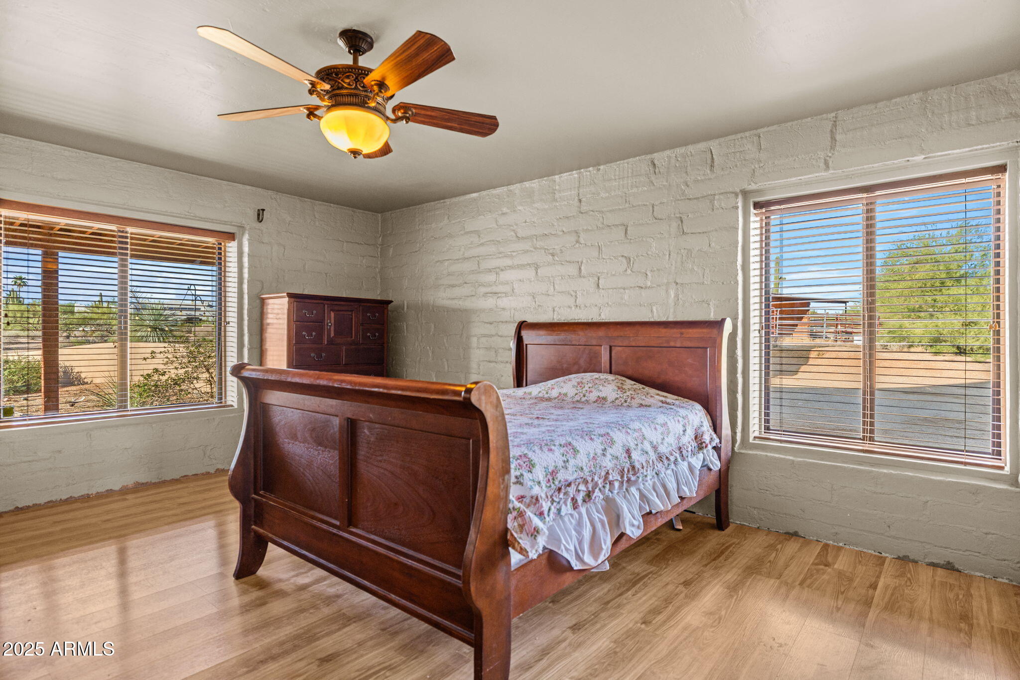 6319 East Lowden Road Cave Creek, AZ 85331 - Photo 30 of 52 a bedroom with a bed and a large window with outer view