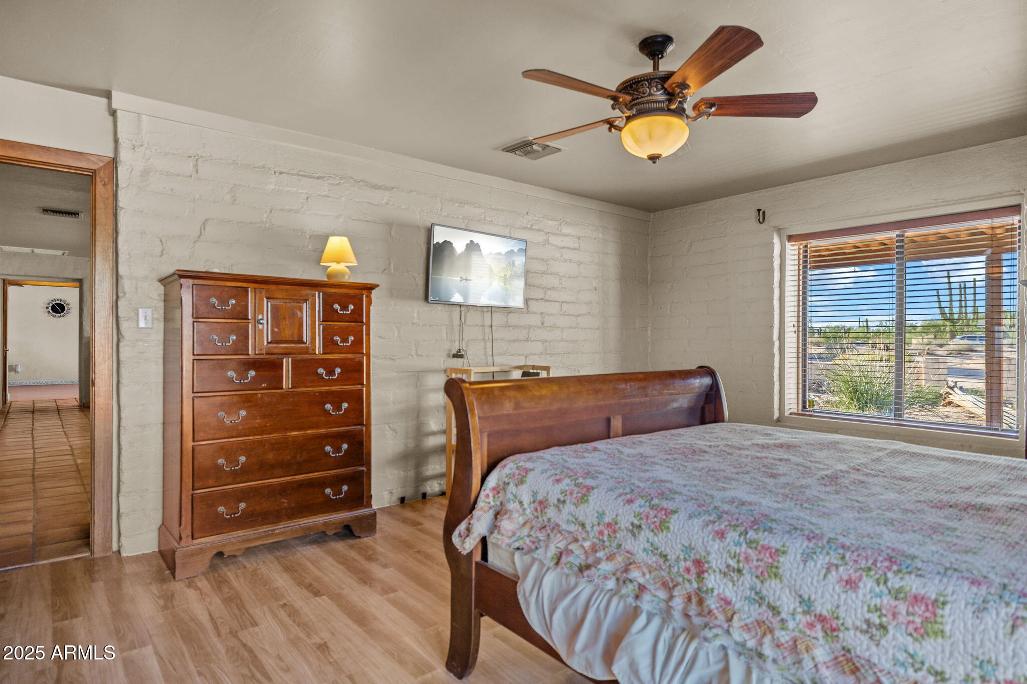 6319 East Lowden Road Cave Creek, AZ 85331 - Photo 31 of 52 a bedroom with a bed and a ceiling fan