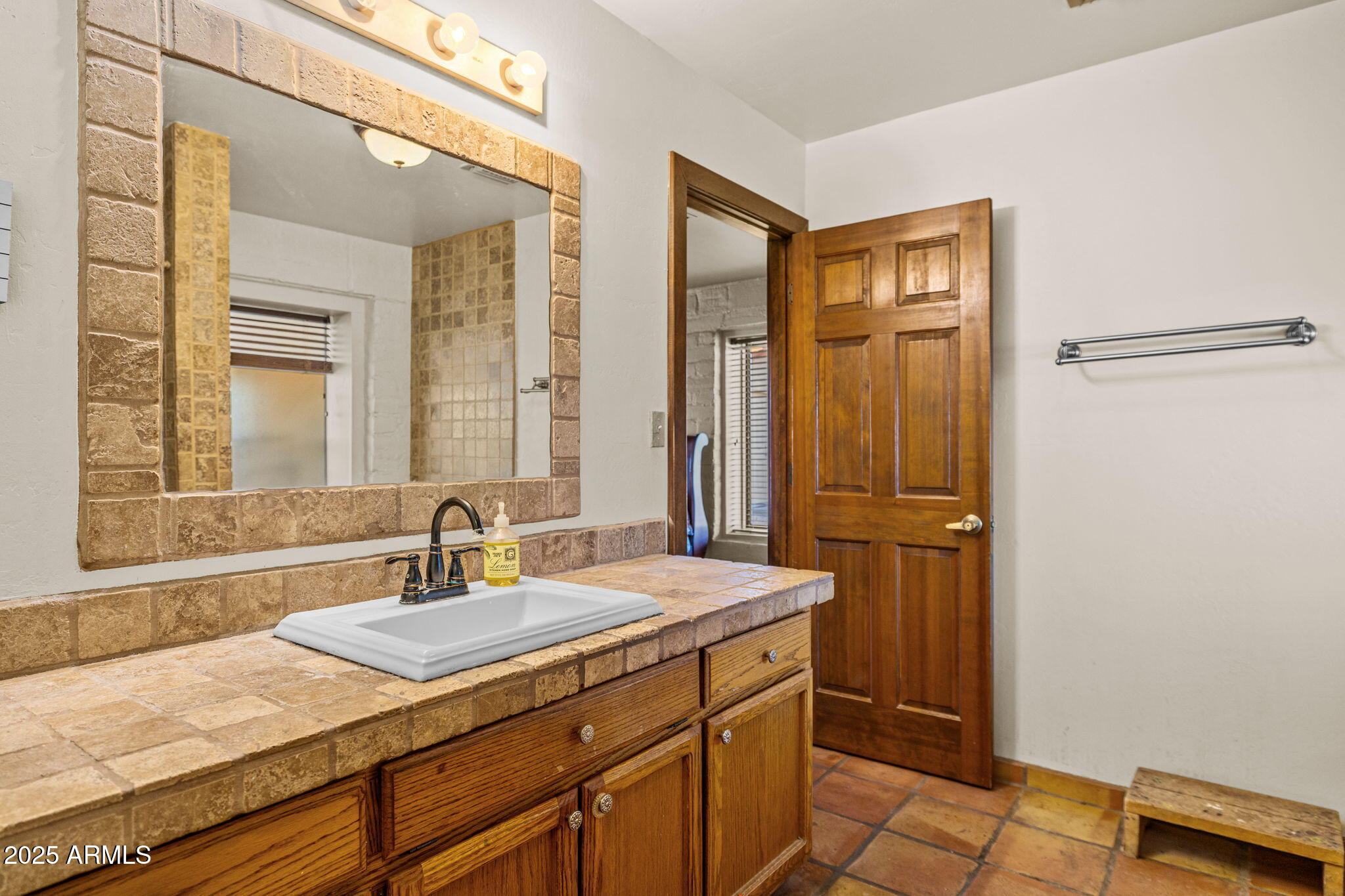 6319 East Lowden Road Cave Creek, AZ 85331 - Photo 34 of 52 a bathroom with a sink and a mirror