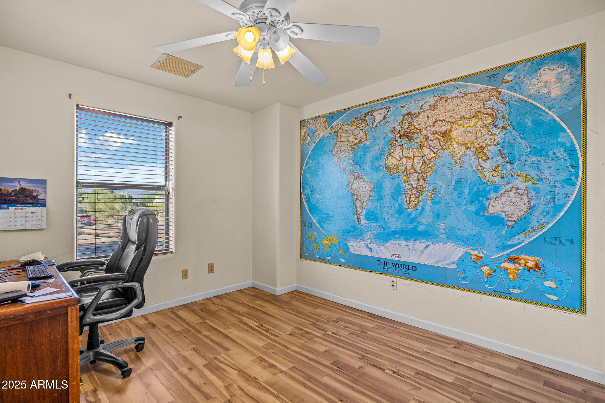 6319 East Lowden Road Cave Creek, AZ 85331 - Photo 39 of 52 a view of a workspace with furniture and a window