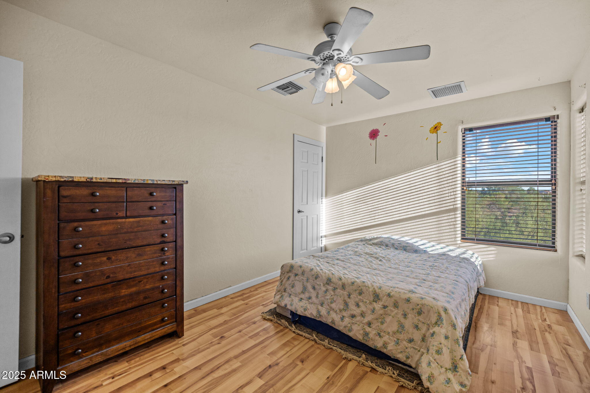 6319 East Lowden Road Cave Creek, AZ 85331 - Photo 42 of 52 a bedroom with a bed and a chandelier