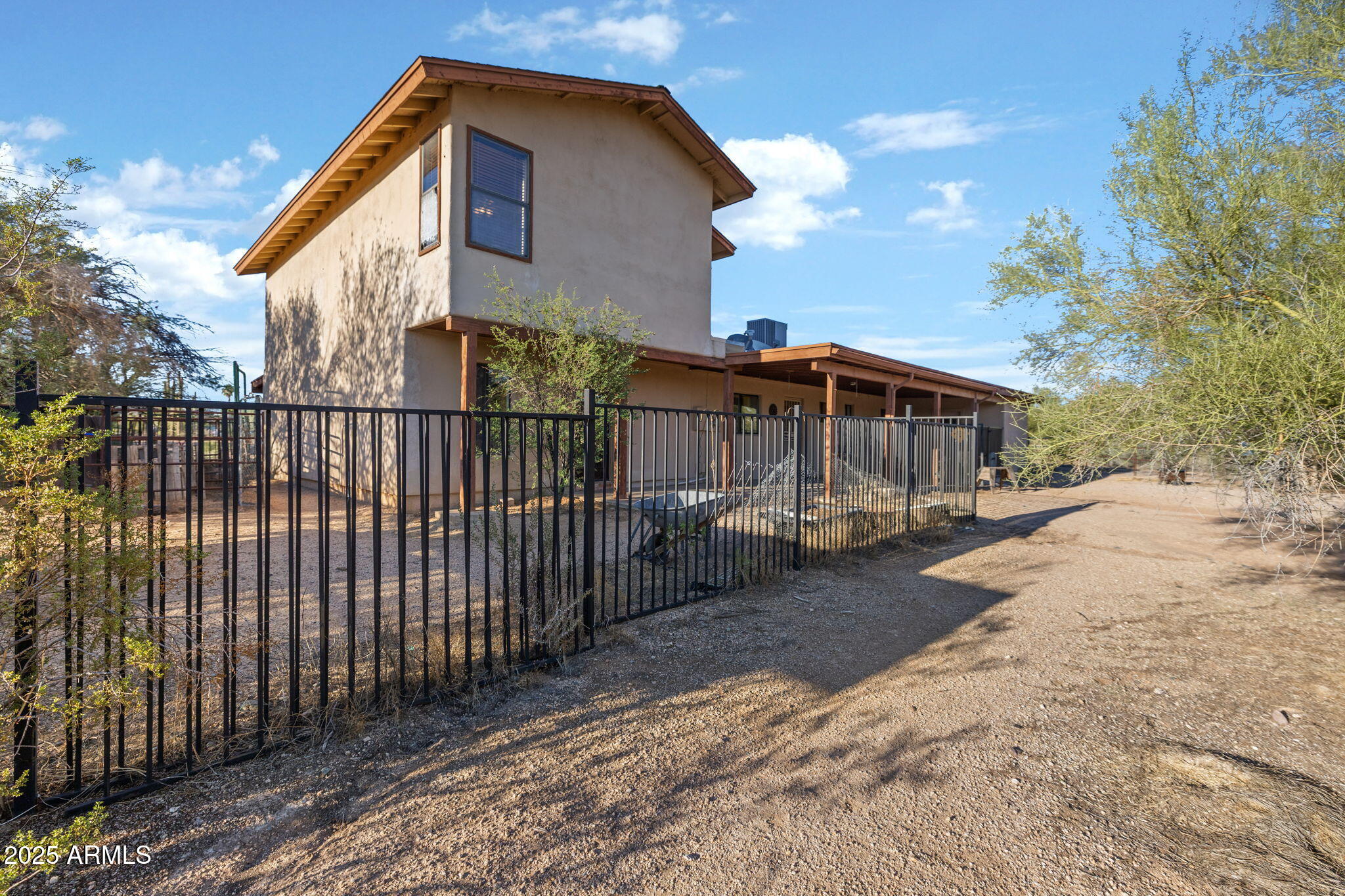 6319 East Lowden Road Cave Creek, AZ 85331 - Photo 43 of 52 a view of a house with a yard