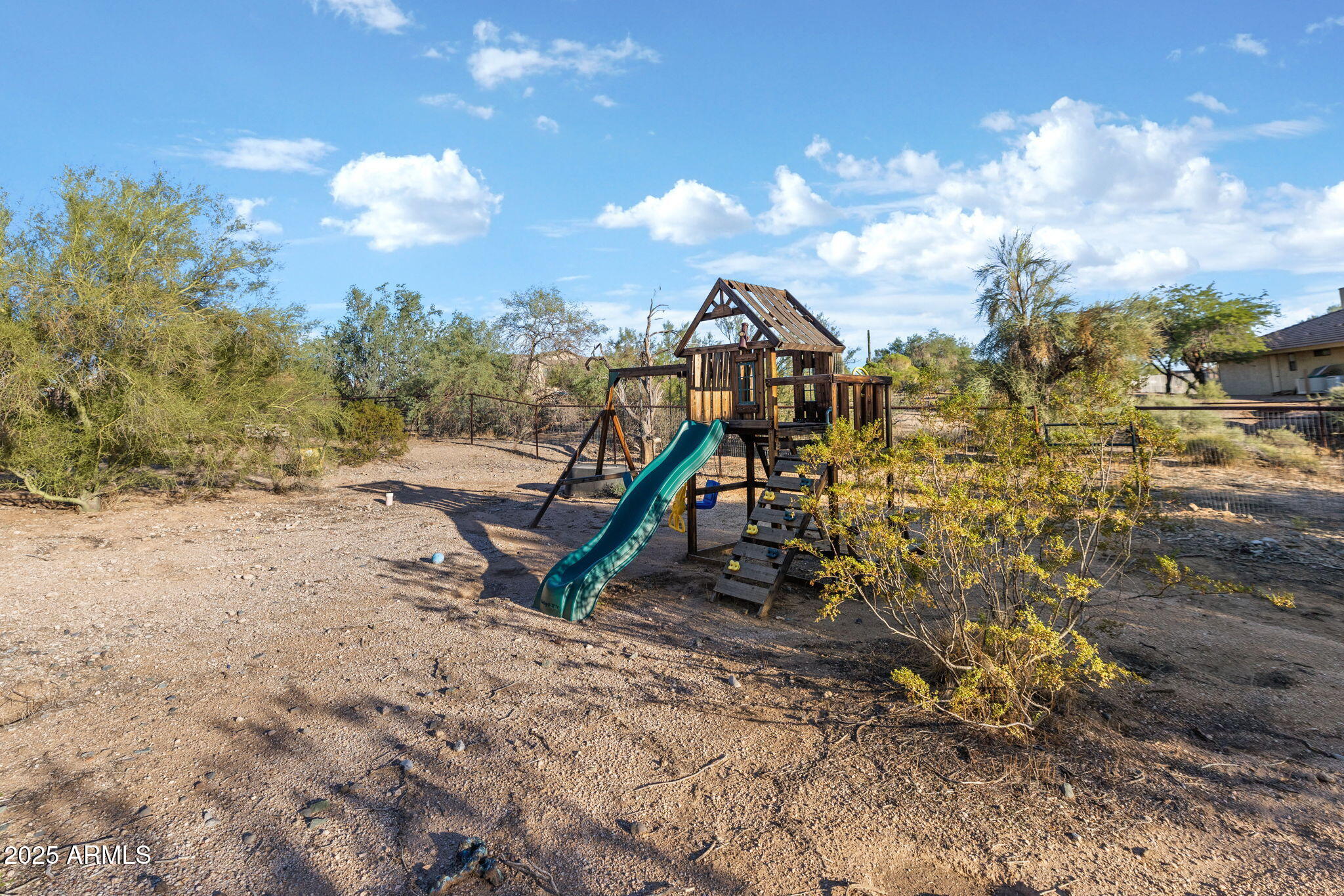 6319 East Lowden Road Cave Creek, AZ 85331 - Photo 44 of 52 a view of a park with swings and slides
