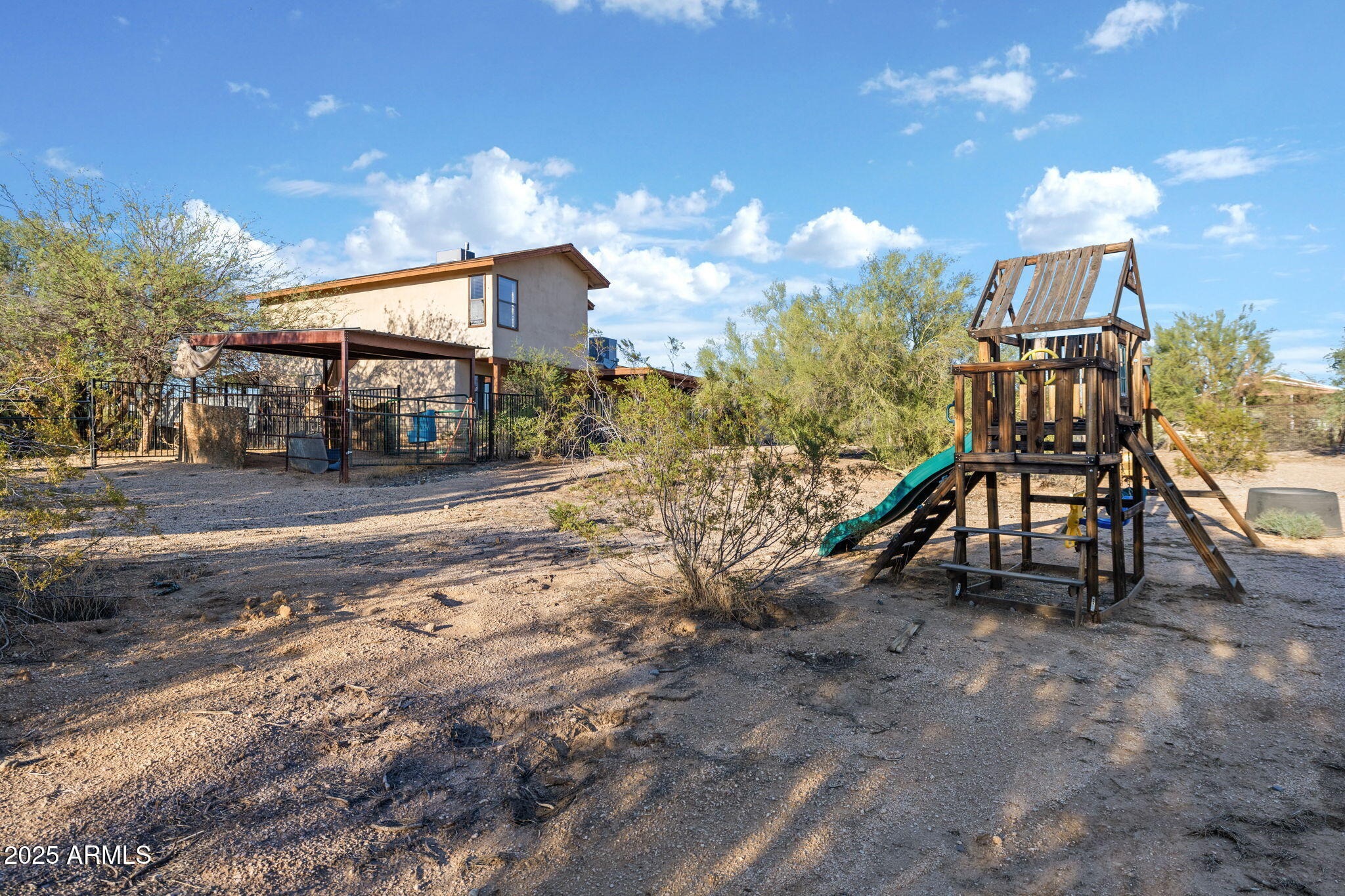 6319 East Lowden Road Cave Creek, AZ 85331 - Photo 45 of 52 a view of a house with a snow in a yard