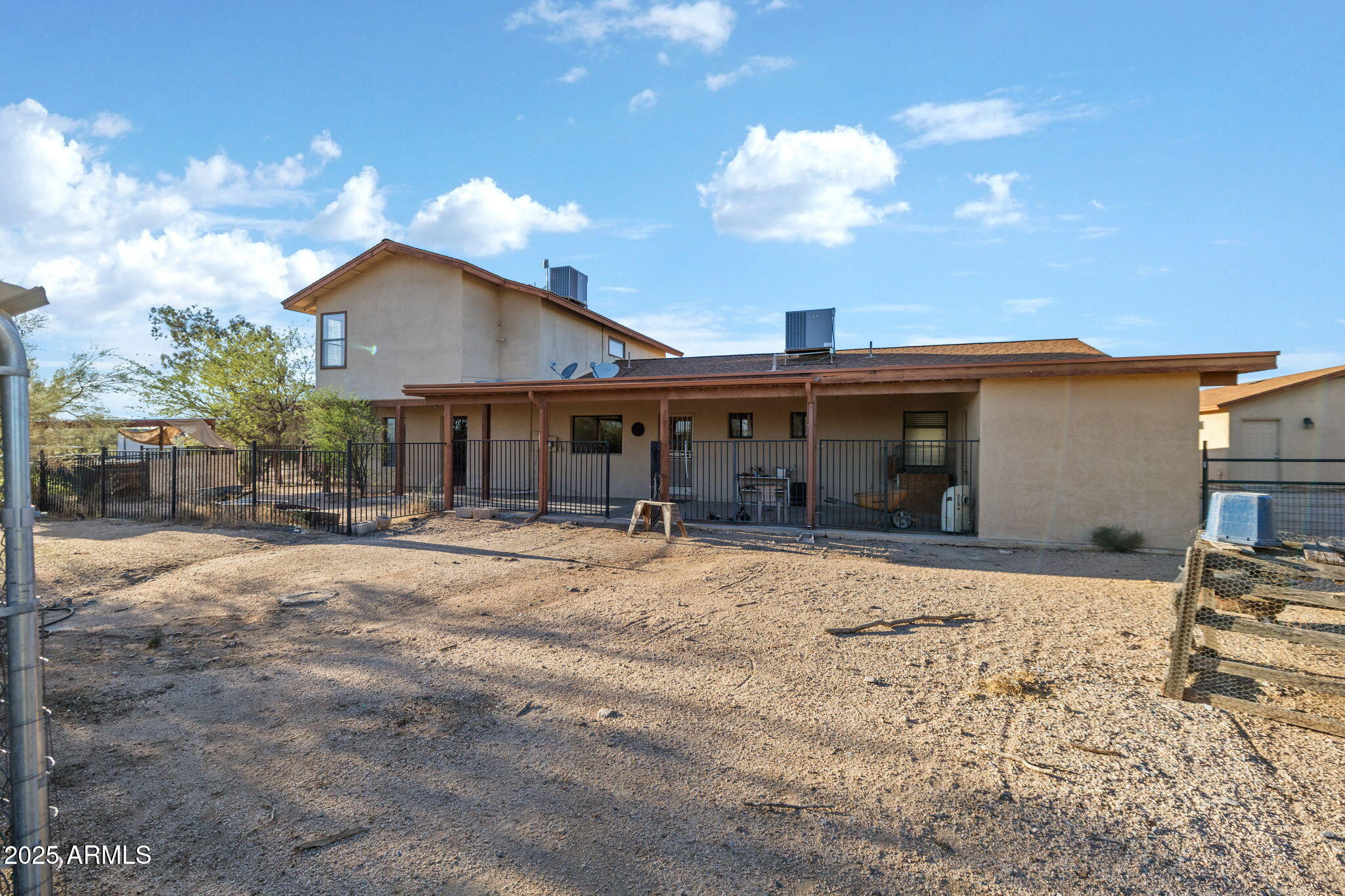 6319 East Lowden Road Cave Creek, AZ 85331 - Photo 47 of 52 a front view of a house with a yard and garage