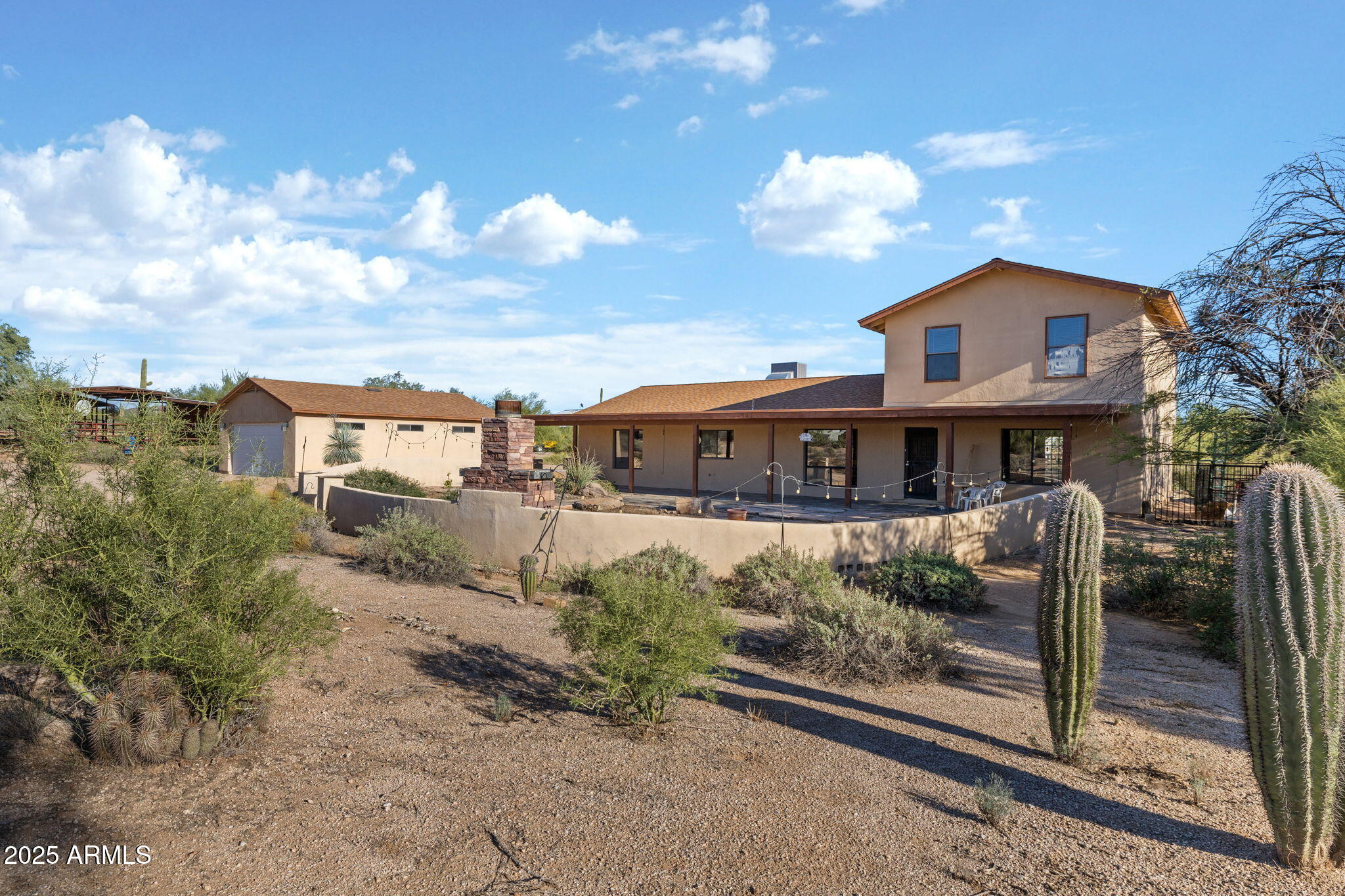 6319 East Lowden Road Cave Creek, AZ 85331 - Photo 9 of 52 a front view of a house with a yard
