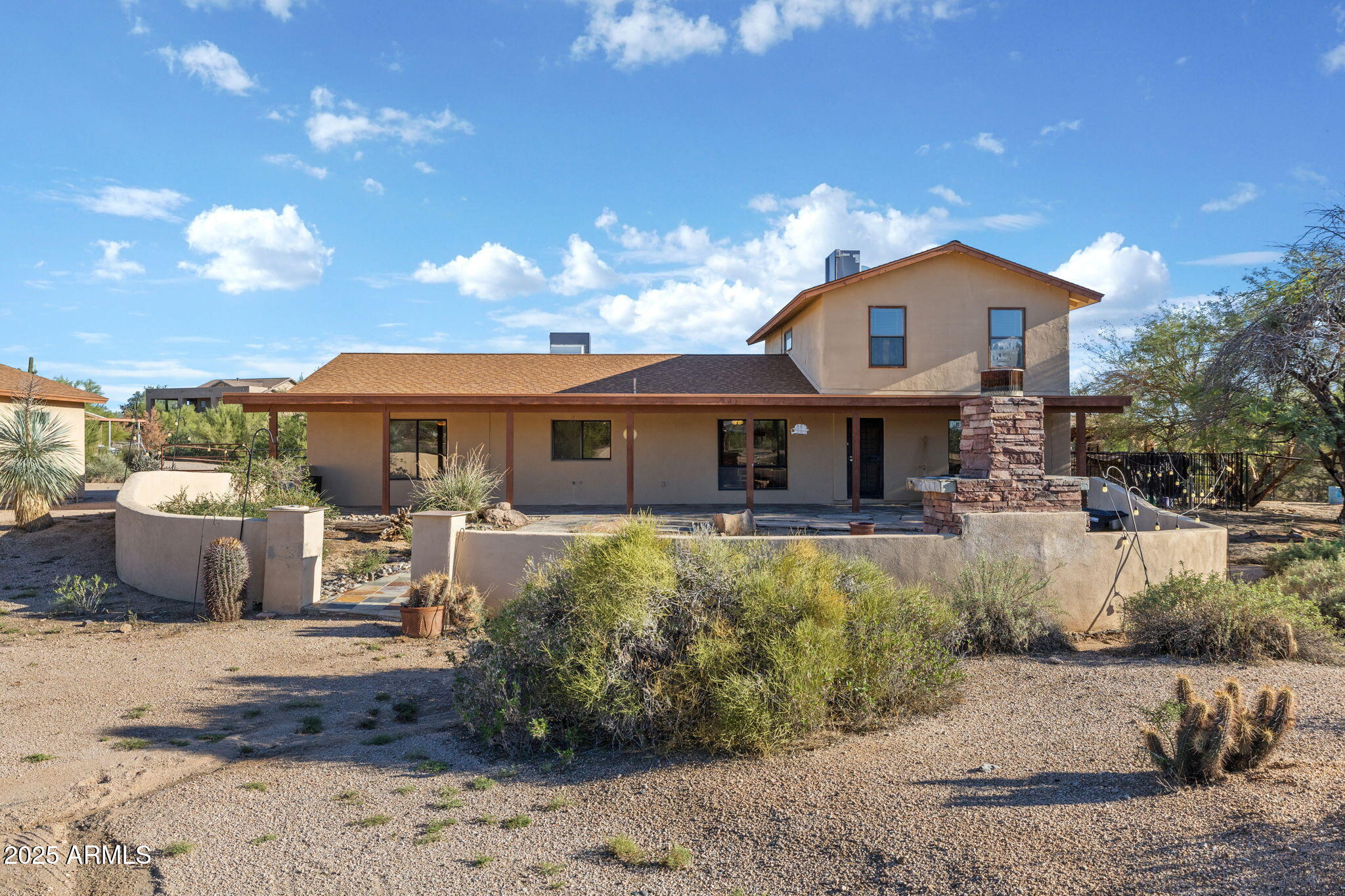 6319 East Lowden Road Cave Creek, AZ 85331 - Photo 10 of 52 a front view of a house with a yard