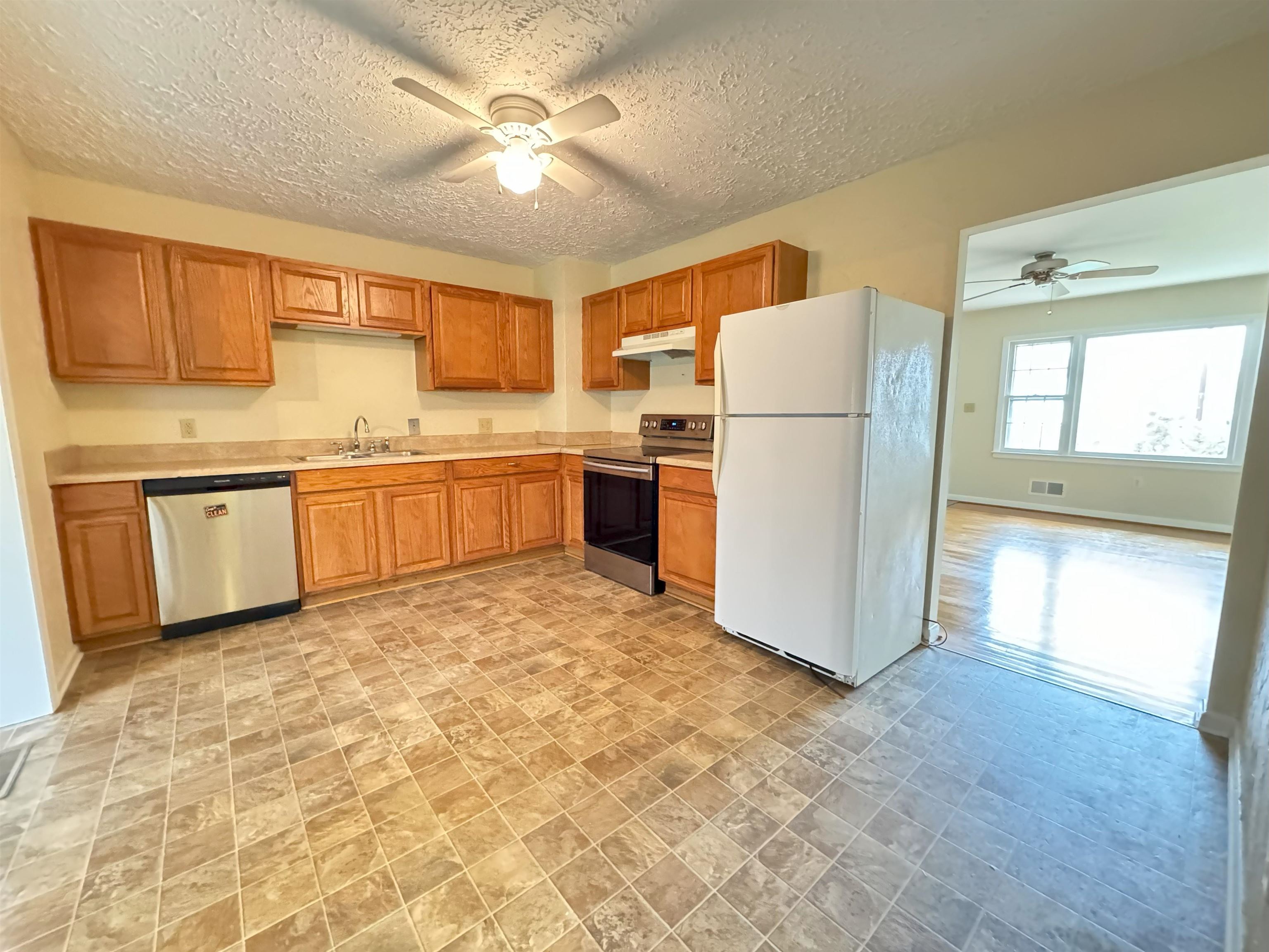111 Devon Road Staunton, VA 24401 - Photo 13 of 28 a kitchen with a refrigerator a sink dishwasher and a refrigerator