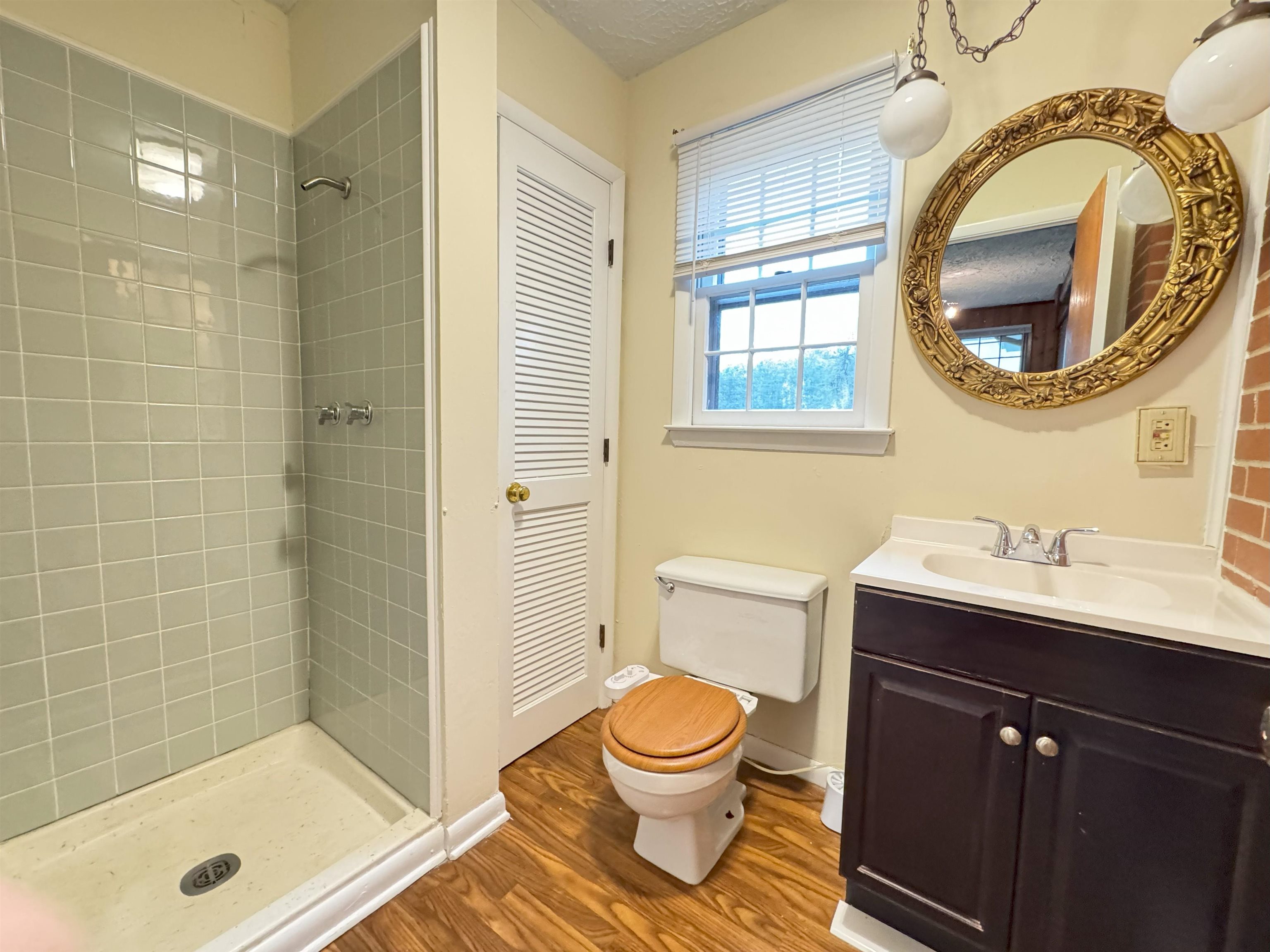 111 Devon Road Staunton, VA 24401 - Photo 19 of 28 a bathroom with a sink a toilet and a mirror