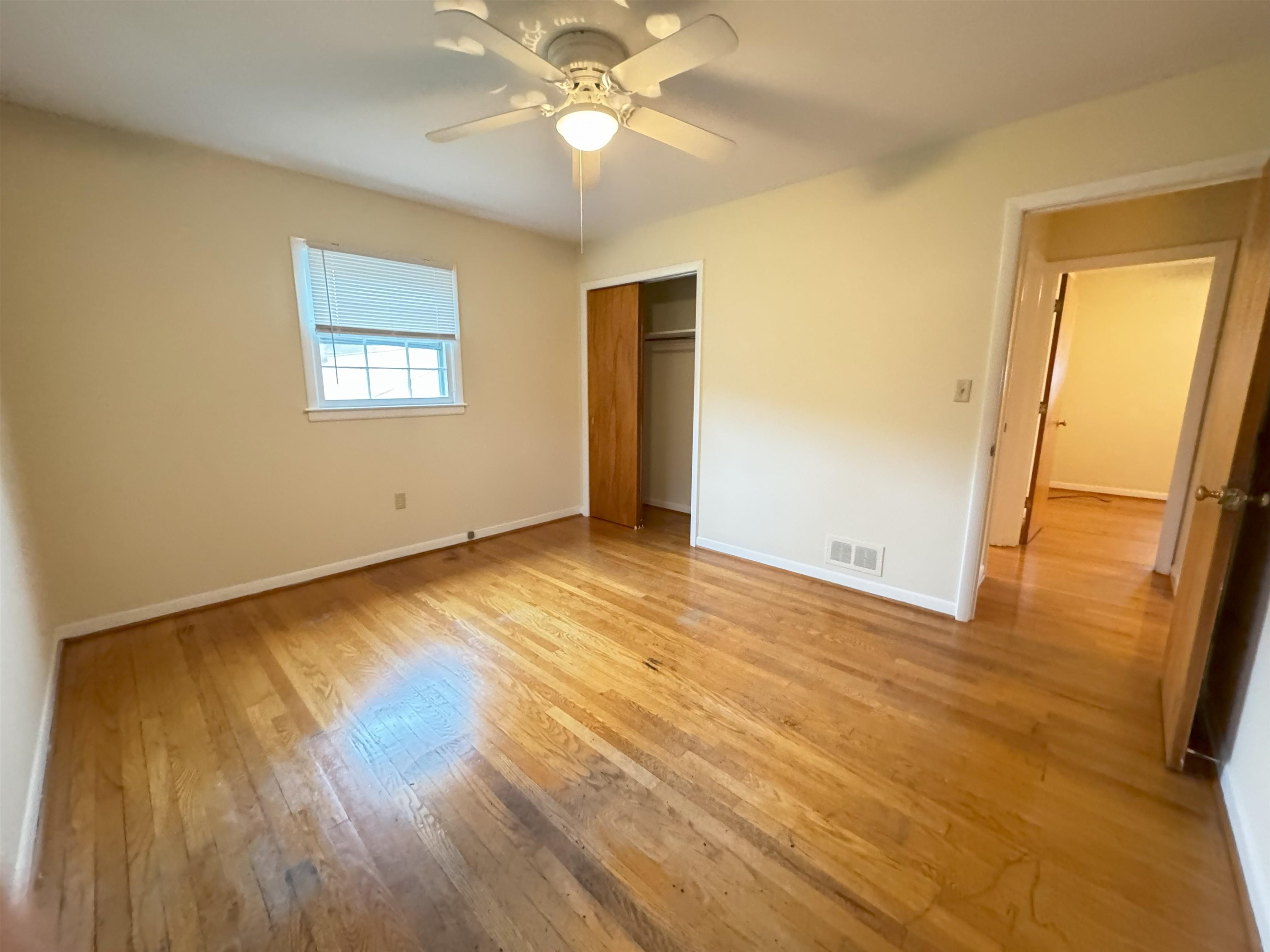 111 Devon Road Staunton, VA 24401 - Photo 23 of 28 a view of an empty room with wooden floor and a window