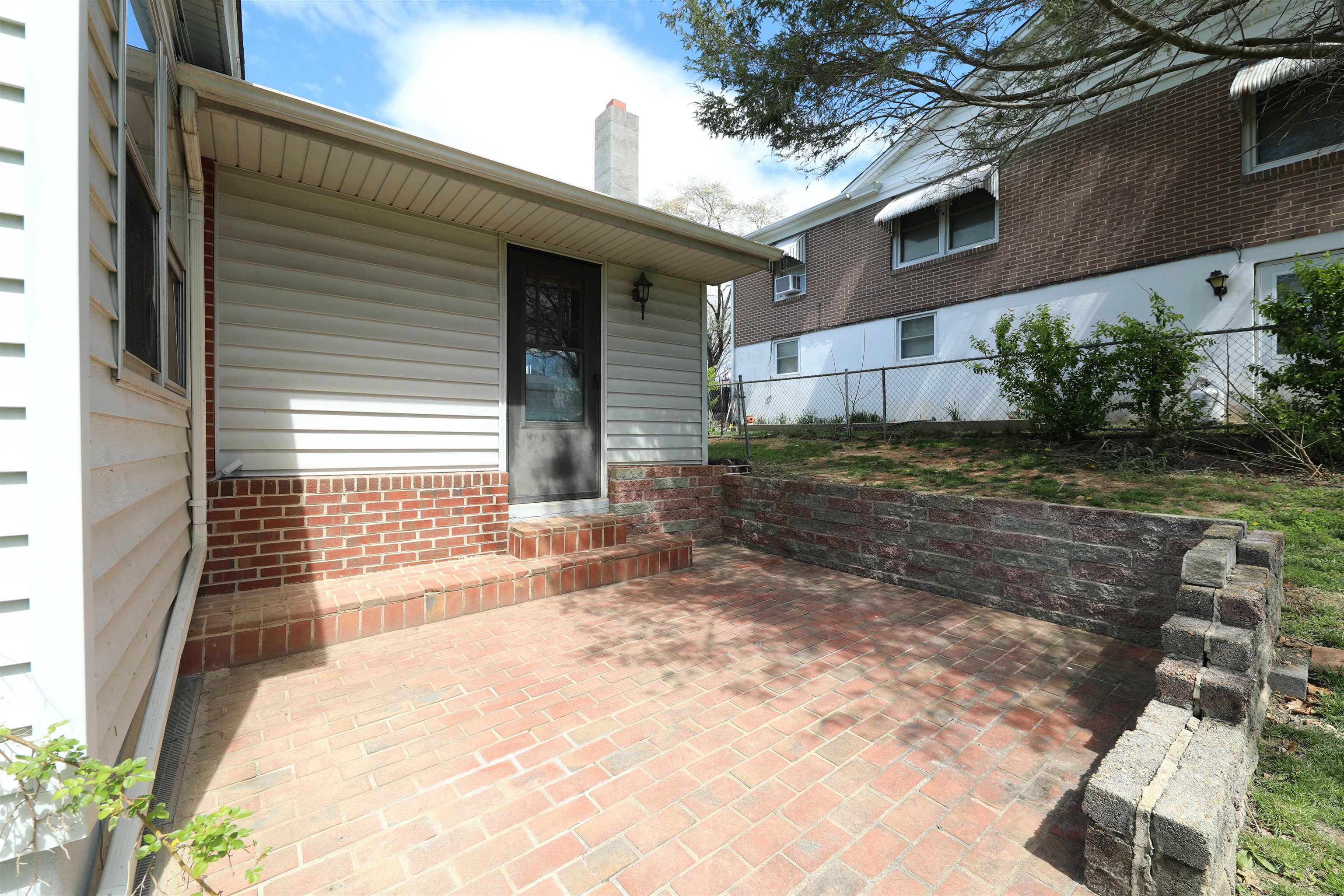 111 Devon Road Staunton, VA 24401 - Photo 6 of 28 a view of a backyard with plants and large tree