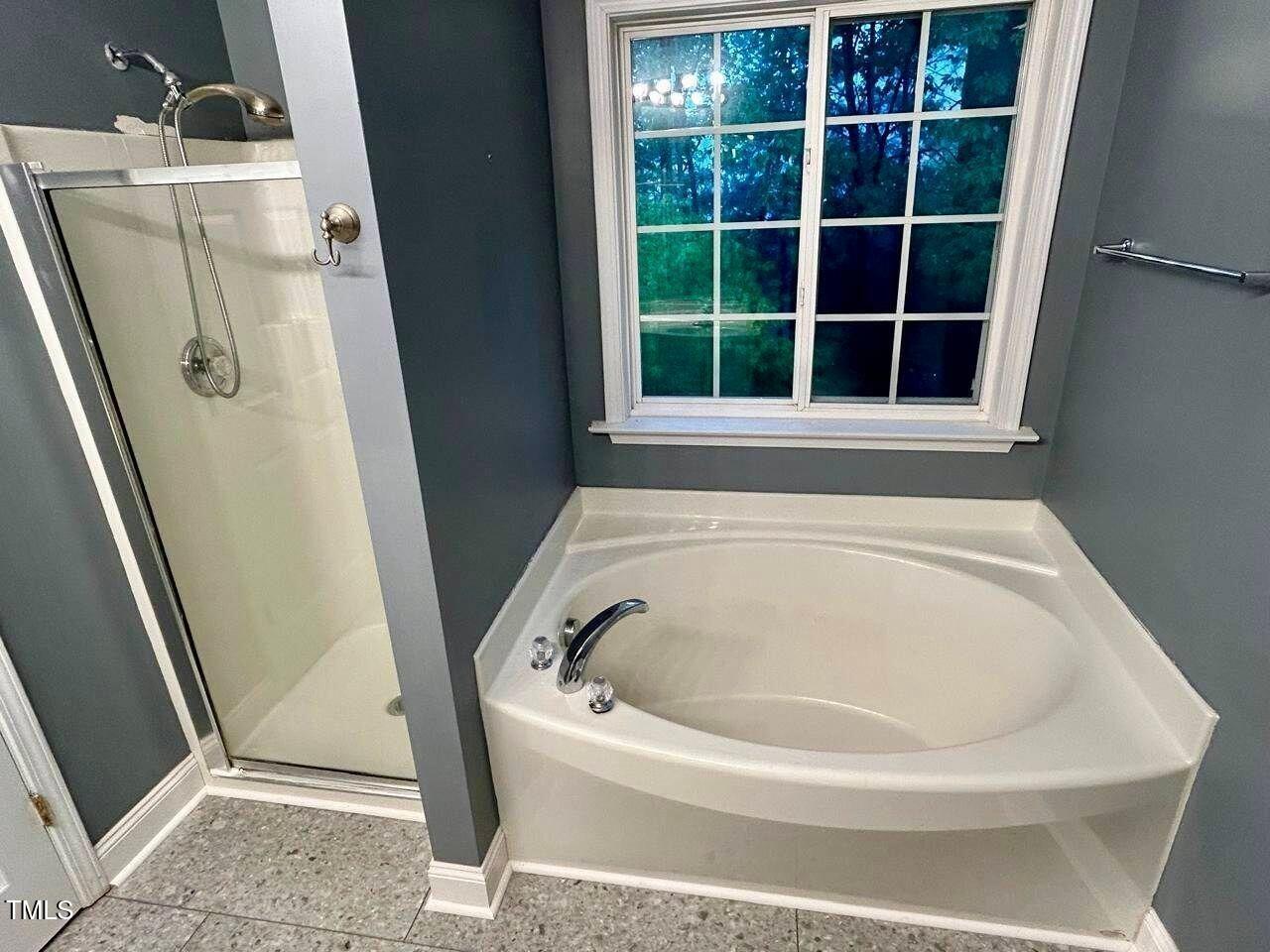 33 Sharpstone Lane Durham, NC 27703 - Photo 11 of 17 a bathroom with a bathtub
