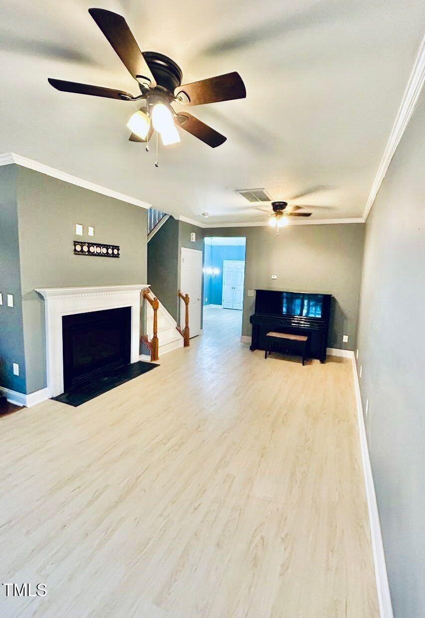 33 Sharpstone Lane Durham, NC 27703 - Photo 2 of 17 a living room with furniture and a fireplace