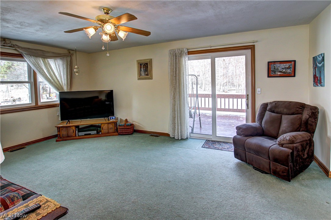 3711 Ruth Drive Brunswick, OH 44212 - Photo 8 of 35 Family room featuring light colored carpet and ceiling fan