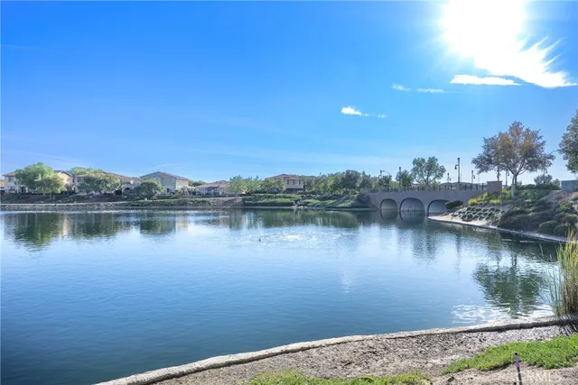 a view of a patio with swimming pool and a yard