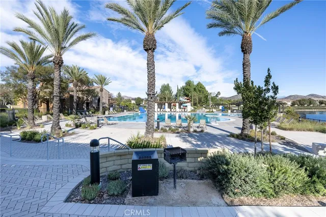 a view of a livingroom with furniture and a hallway