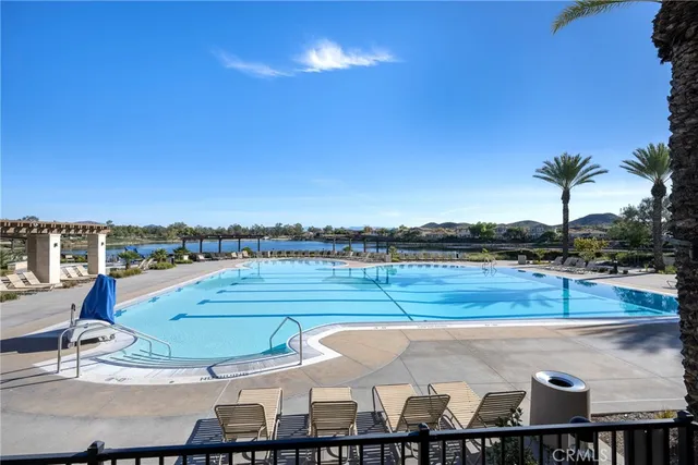 a view of a livingroom with workspace and a window